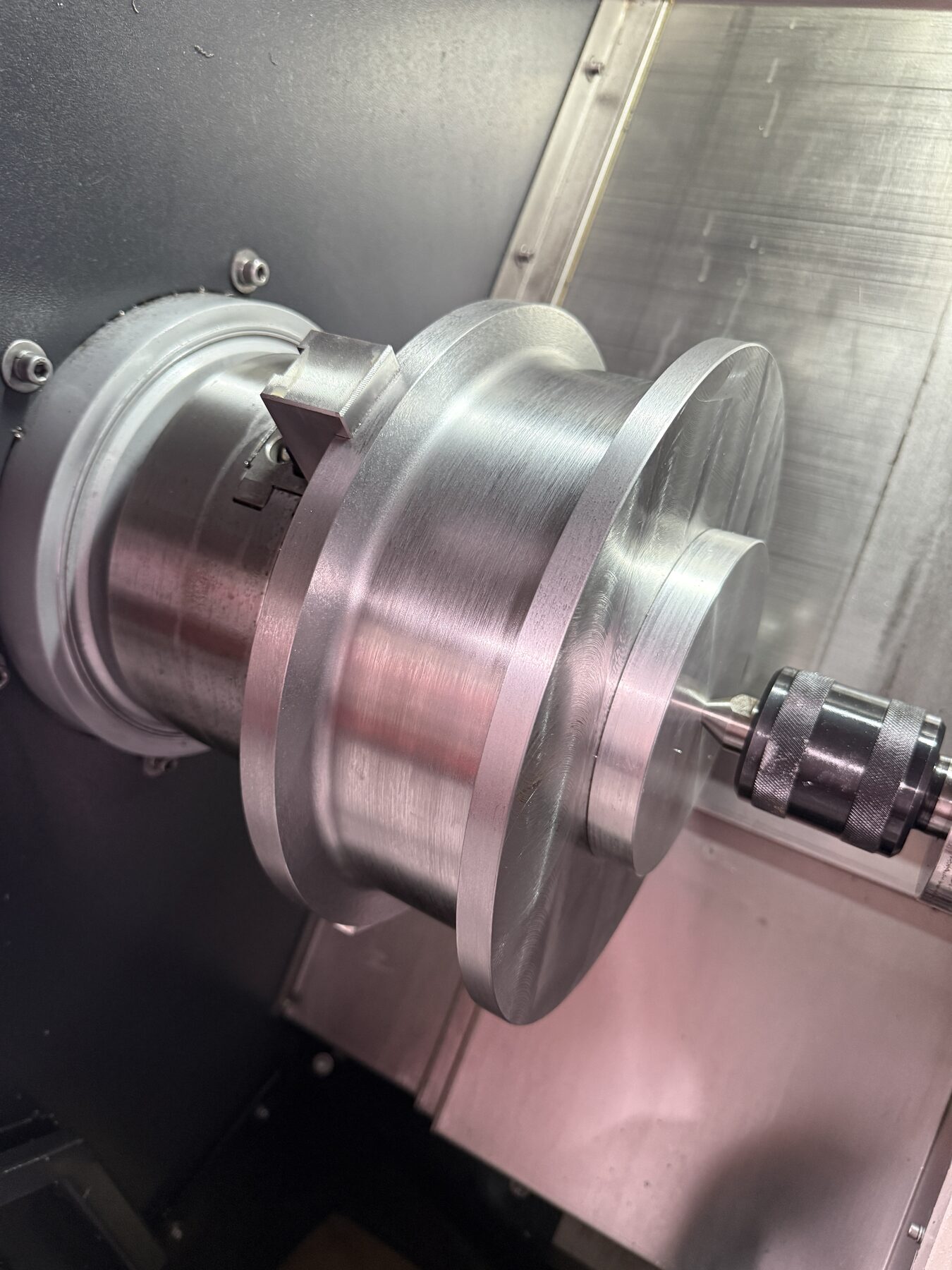 Crane wheel being turned on a CNC lathe at Advance Machining Inc.